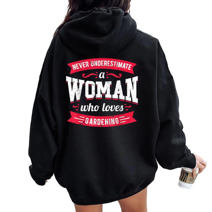 Never Underestimate A Woman Who Loves Gardening Women Oversized Hoodie Back Print