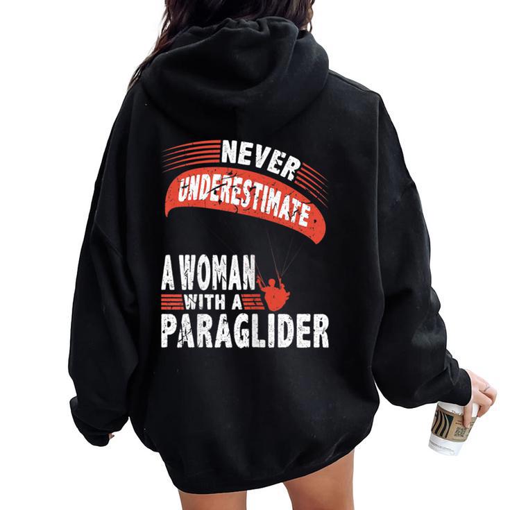 Never Underestimate Woman Paraglider Parachute Women Oversized Hoodie Back Print