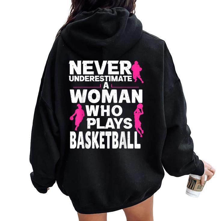 Never Underestimate A Woman Who Plays Basketball Women Oversized Hoodie Back Print