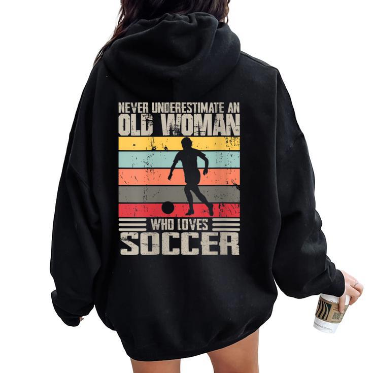 Vintage Never Underestimate An Old Woman Who Loves Soccer Women Oversized Hoodie Back Print