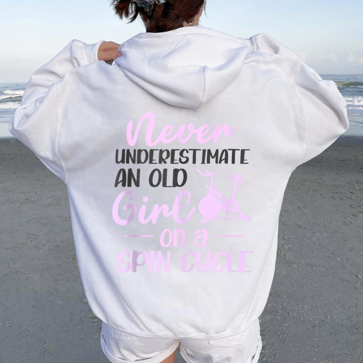 Spinning Class Never Underestimate An Old Girl Spin Women Oversized Hoodie Back Print