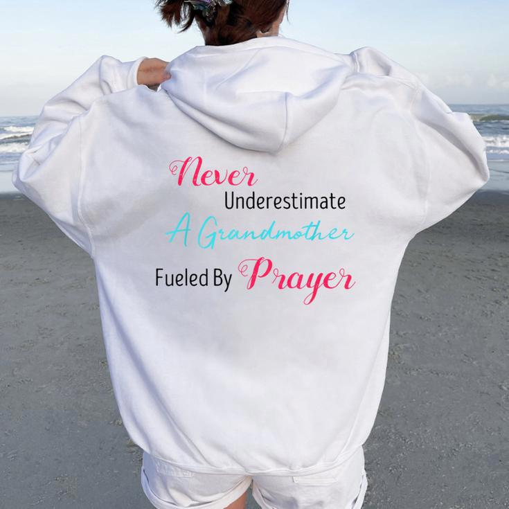 Never Underestimate A Grandmother Fueled By Prayer Women Oversized Hoodie Back Print