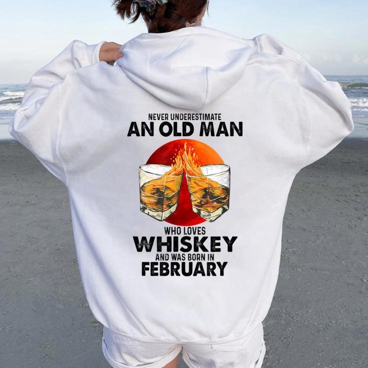 Never Underestimate An Old February Man Who Loves Whiskey Women Oversized Hoodie Back Print