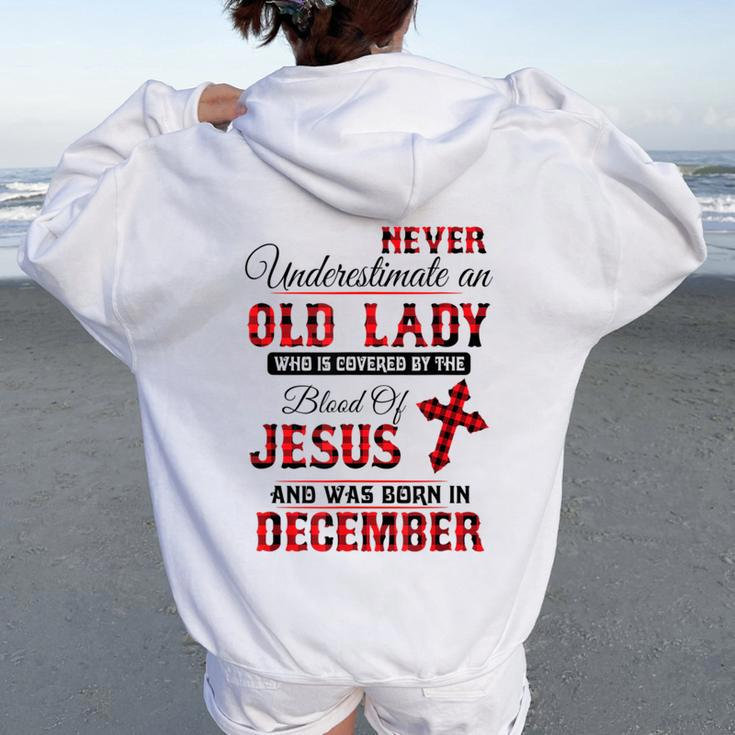 Never Underestimate An Old Lady Was Born In December Women Oversized Hoodie Back Print