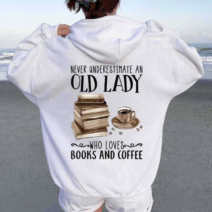 Never Underestimate An Old Lady Who Loved Books And Coffee Women Oversized Hoodie Back Print