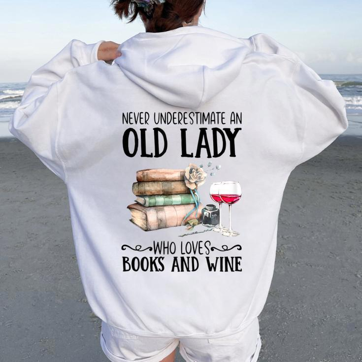 Never Underestimate An Old Lady Who Loves Books And Wine Women Oversized Hoodie Back Print