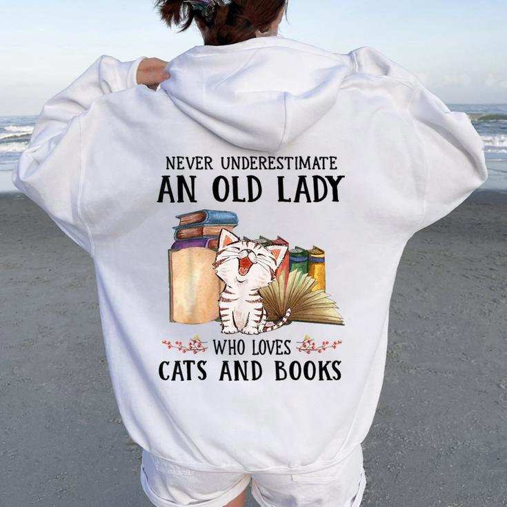 Never Underestimate An Old Lady Who Loves Cats And Books Women Oversized Hoodie Back Print