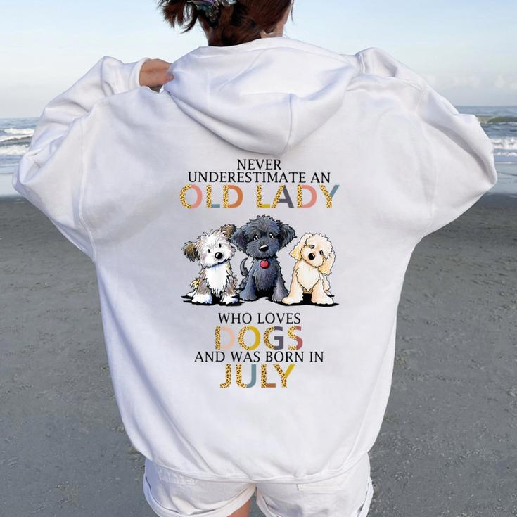 Never Underestimate Old Lady Loves Dogs Born In July Women Oversized Hoodie Back Print
