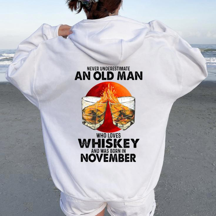 Never Underestimate An Old November Man Who Loves Whiskey Women Oversized Hoodie Back Print