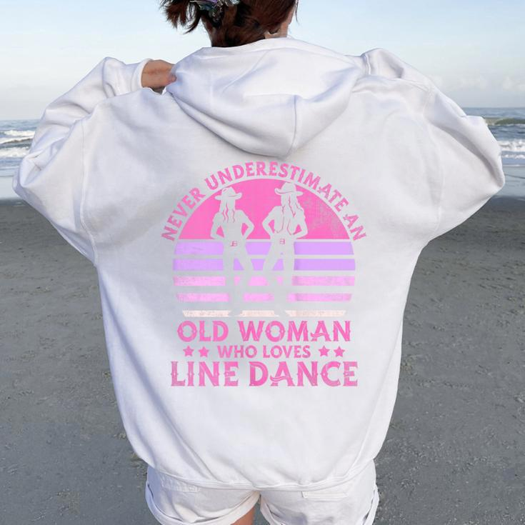 Never Underestimate An Old Woman Who Loves Line Dance Women Oversized Hoodie Back Print