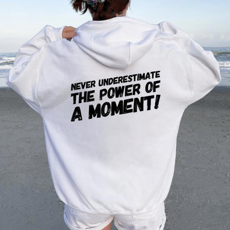Never Underestimate The Power Of A Moment Women Oversized Hoodie Back Print