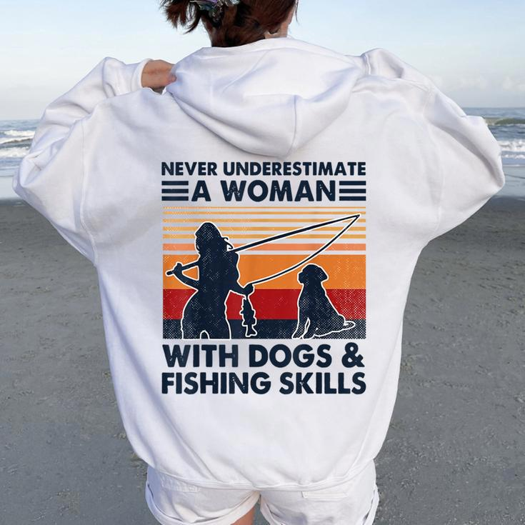 Never Underestimate A Woman With Dogs And Fishing Skills Women Oversized Hoodie Back Print