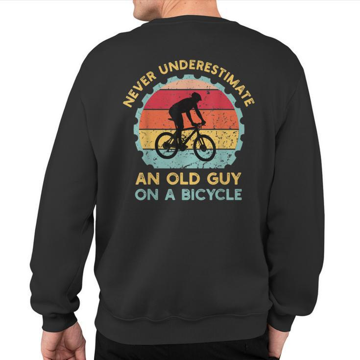 Never Underestimate An Old Guy On A Bicycle Vintage Sweatshirt Back Print