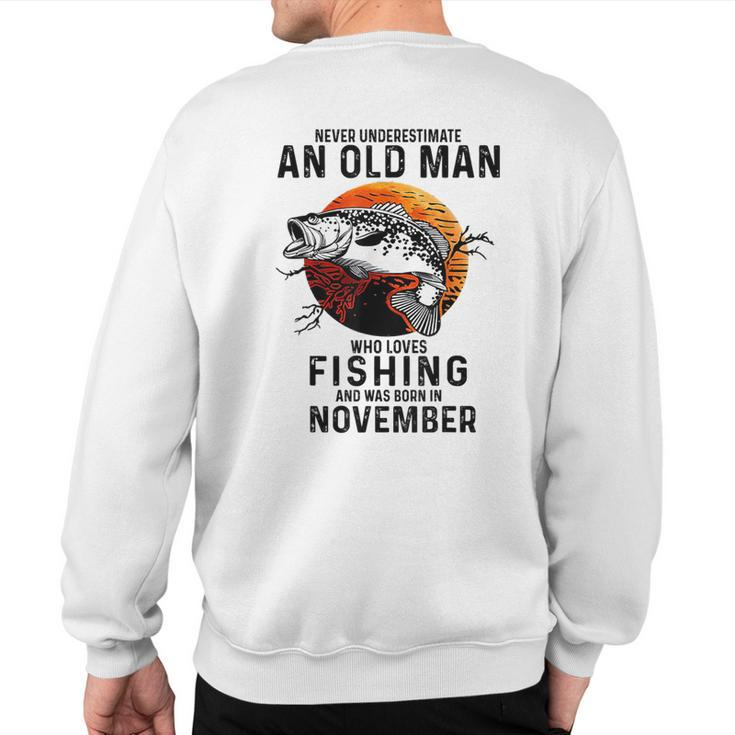 Never Underestimate An Old Man Fishing Was Born In November Sweatshirt Back Print