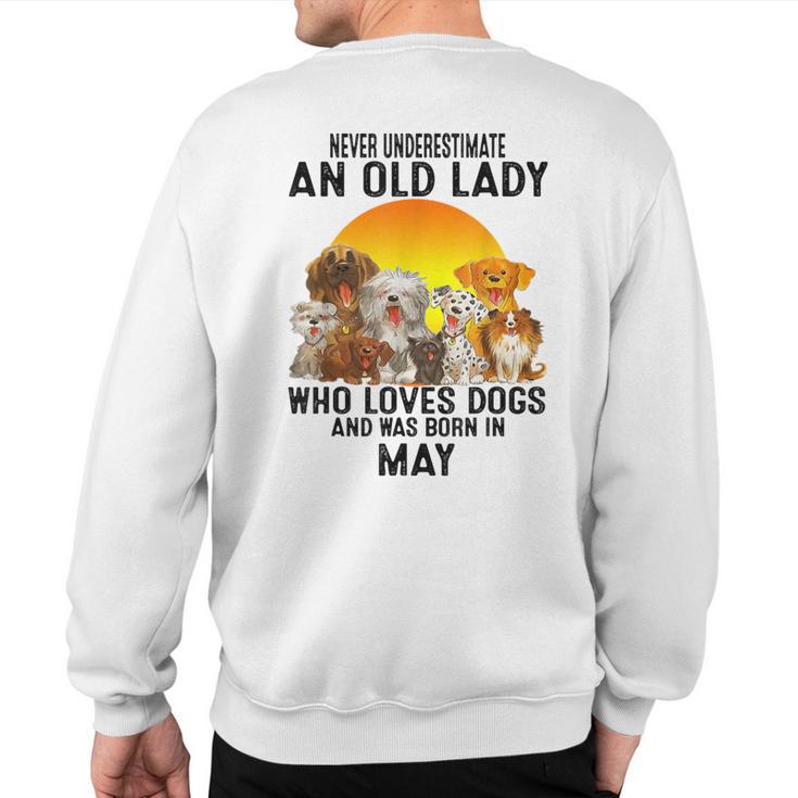 Never Underestimate An Old May Lady Who Loves Dogs Sweatshirt Back Print