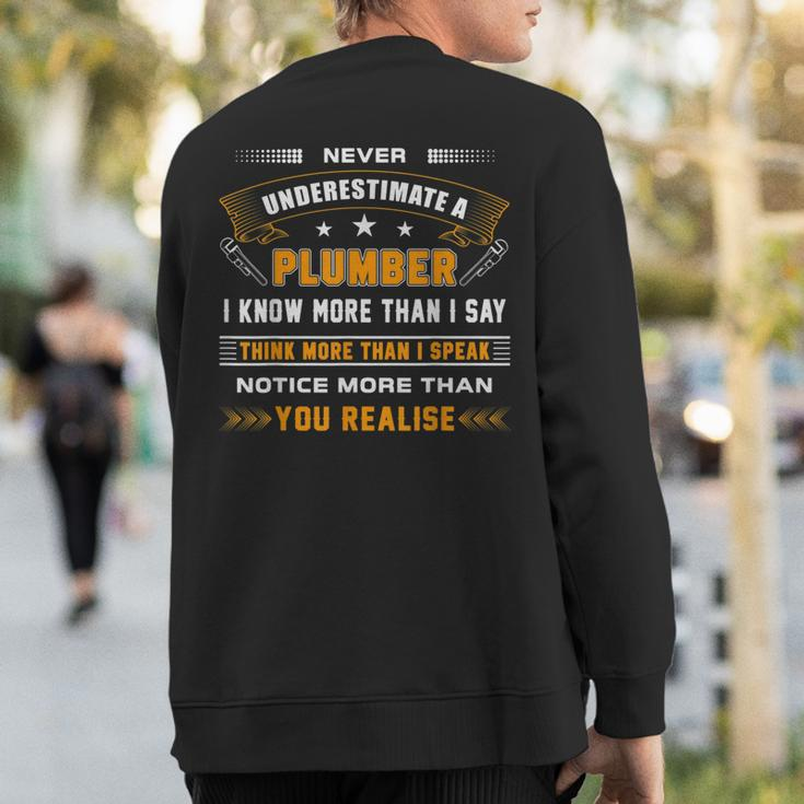 Never Underestimate A Plumber Apparel For Plumbers Sweatshirt Back Print
