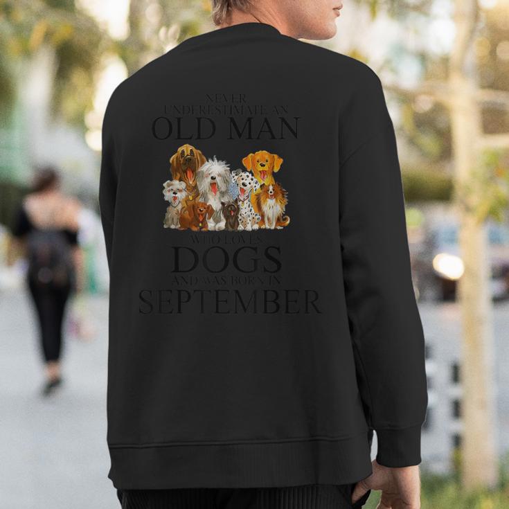 Never Underestimate An Old Man Who Loves Dogs In September Sweatshirt Back Print