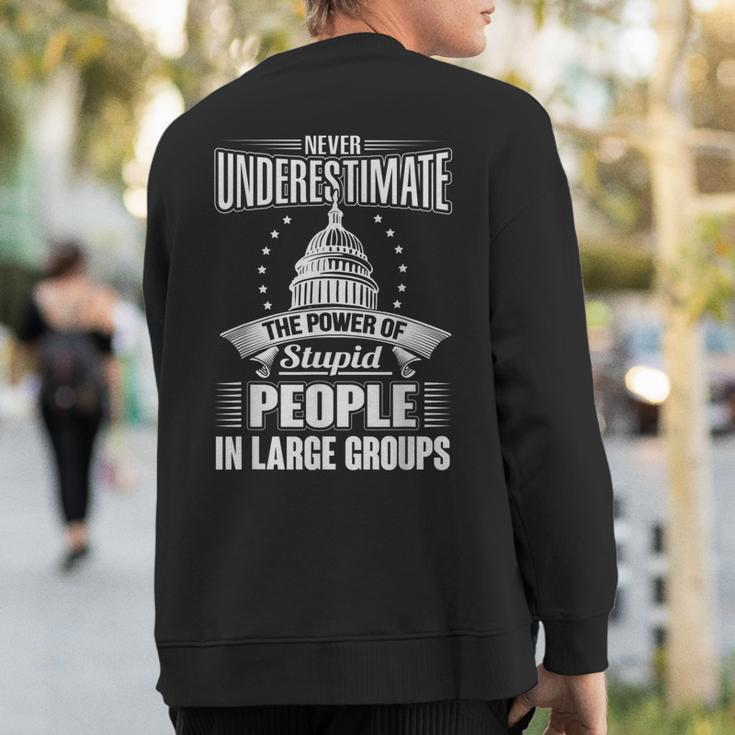 Never Underestimate The Power Of Stupid Political Sweatshirt Back Print