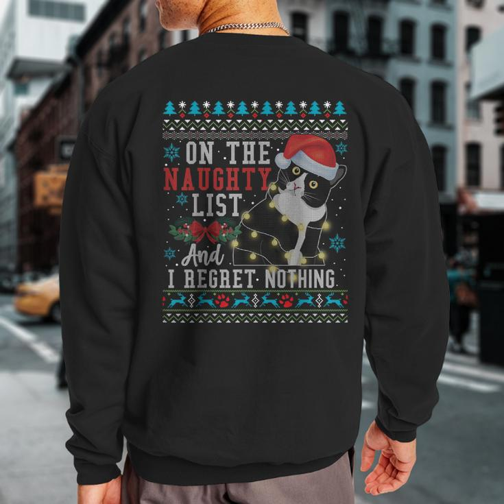 On The Naughty List And I Regret Nothing Cat Christmas Sweatshirt Back Print