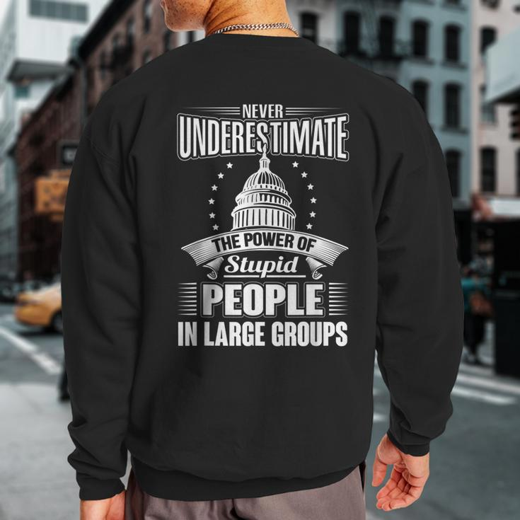 Never Underestimate The Power Of Stupid Political Sweatshirt Back Print