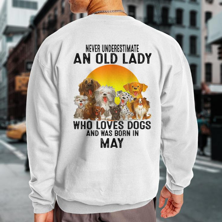 Never Underestimate An Old May Lady Who Loves Dogs Sweatshirt Back Print
