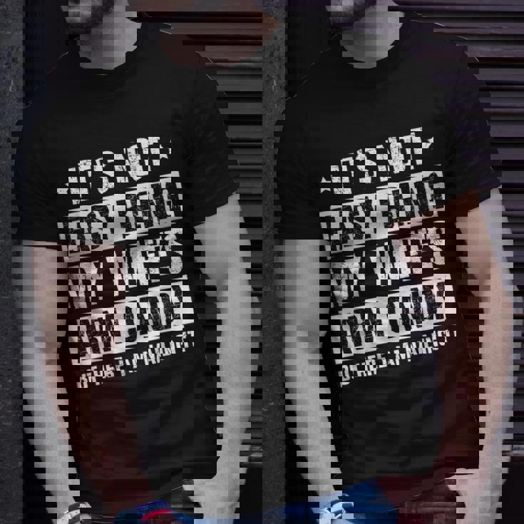 Its Not Easy Being My Wifes Arm Candy Here I Am Nailing It Unisex T-Shirt Gifts for Him