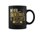 Never Underestimate A Detective's Job Coffee Mug