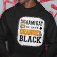 On Gameday Football We Wear Orange And Black Leopard Print Hoodie Unique Gifts