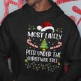 Most Likely To Peek Under The Christmas Tree Christmas Hoodie Funny Gifts
