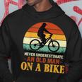 Never Underestimate Funny Quote An Old Man On A Bicycle Retr Hoodie Funny Gifts
