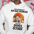 Never Underestimate An Old Woman Who Loves Dogs Born October Old Woman Funny Gifts Hoodie Unique Gifts