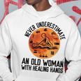 Never Underestimate An Old Woman With Healing Hands Old Woman Funny Gifts Hoodie Unique Gifts