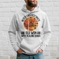Never Underestimate An Old Woman With Healing Hands Old Woman Funny Gifts Hoodie Gifts for Him