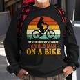 Never Underestimate Funny Quote An Old Man On A Bicycle Retr Sweatshirt Gifts for Old Men
