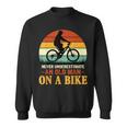 Never Underestimate Funny Quote An Old Man On A Bicycle Retr Sweatshirt