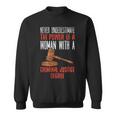 Never Underestimate The Power Of A Woman With A Criminal Sweatshirt
