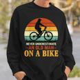 Never Underestimate Funny Quote An Old Man On A Bicycle Retr Sweatshirt Gifts for Him