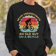 Never Underestimate An Old Guy On A Bicycle Vintage Sweatshirt Gifts for Him