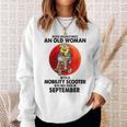 Never Underestimate An Old Woman Mobility Scooter September Old Woman Funny Gifts Sweatshirt Gifts for Her