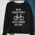 Bicycle Never Underestimate An Old Woman On A Bike Funny Old Woman Funny Gifts Sweatshirt Gifts for Old Women