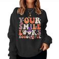 Your Smile Looks Bootiful Dentist Halloween Spooky Groovy Women Sweatshirt