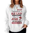 Never Underestimate An Old Lady Was Born In December Women Sweatshirt