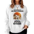 Never Underestimate An Old Woman Who Loves Dogs November Women Sweatshirt