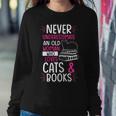 Never Underestimate An Old Woman Who Loves Cats & Books Gift Gift For Womens Women Crewneck Graphic Sweatshirt Funny Gifts