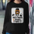 Thick Thighs And Spooky Vibes Messy Bun Girl Halloween Women Sweatshirt Unique Gifts