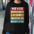 Never Underestimate A Girl With A Hockey Stick Women Sweatshirt Unique Gifts