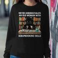 Never Underestimate An Old Woman With Scrapbooking Skills Women Sweatshirt Unique Gifts