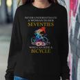 Never Underestimate Woman In Her Seventies Rides A Bicycle Women Sweatshirt Funny Gifts