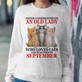 Never Underestimate An Old Lady Who Loves Cats September Women Crewneck Graphic Sweatshirt Funny Gifts