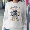Never Underestimate Old Lady Loves Dogs Born In February Women Sweatshirt Funny Gifts